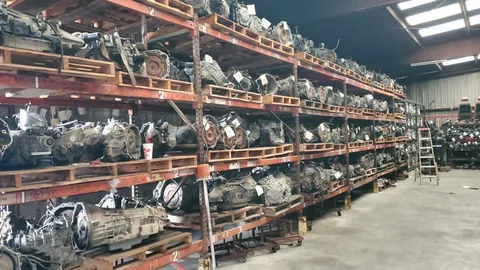 Automotive parts arranged across warehouse shelving at Engine Corner Auto Parts LLC.