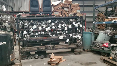 Small automotive components organized on a storage rack at Engine Corner Auto Parts LLC.
