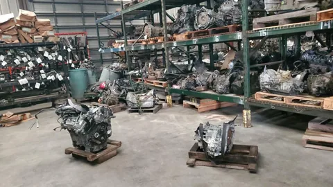 Engines and transmissions arranged in the Engine Corner Auto Parts LLC warehouse.